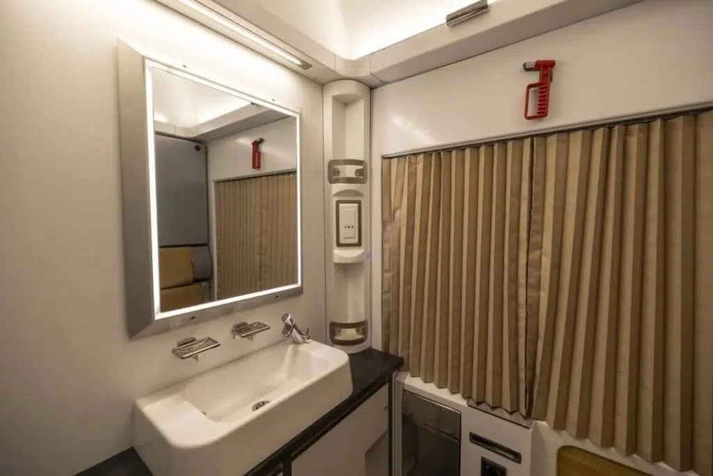 Sink and mirror inside a sleeper train cabin