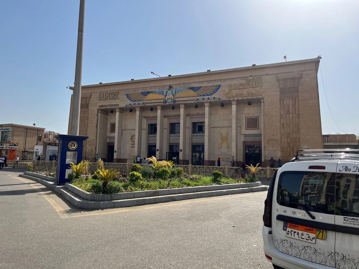 Luxor Railway Station, where the sleeper from Cairo arrives, with a taxi outside